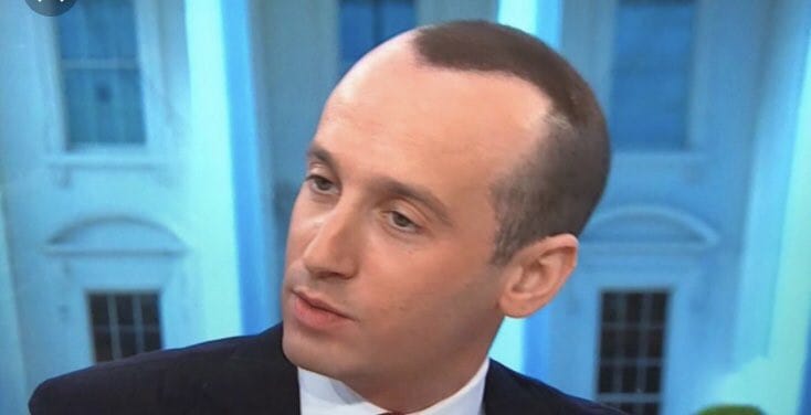 A still image of Deputy White House Chief of Staff Stephen Miller during a first Trump term media appearance showing off a regrettable spray-on hairstyle. 